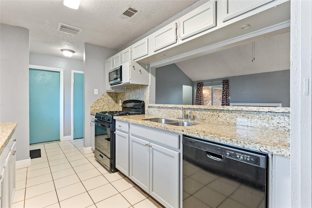 20062 S Pecos Valley Trl, Katy, TX 77449 - kitchen featuring black appliances, tasteful backsplash, light tile patterned flooring, a textured ceiling, and white cabinets