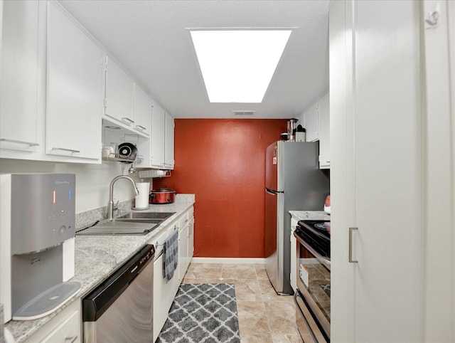 2230 S Piney Point Rd Unit 125, Houston, TX 77063 - kitchen with appliances with stainless steel finishes, light countertops, and white cabinets