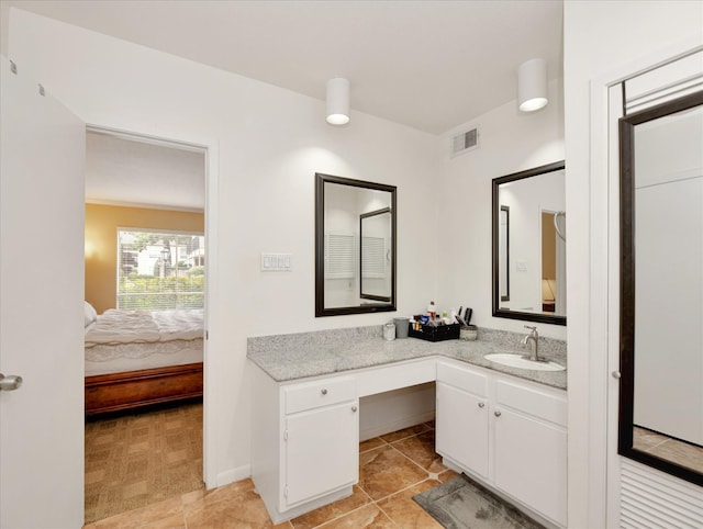 2230 S Piney Point Rd Unit 125, Houston, TX 77063 - ensuite bathroom featuring vanity and tile patterned flooring