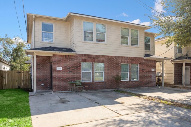 4340 Phlox St A/B, Unit A/B Houston, TX 77051 - townhome / multi-family property featuring a patio area and brick siding