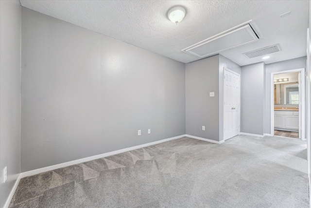 4340 Phlox St A/B, Unit A/B Houston, TX 77051 - empty room featuring attic access, carpet floors, and a textured ceiling