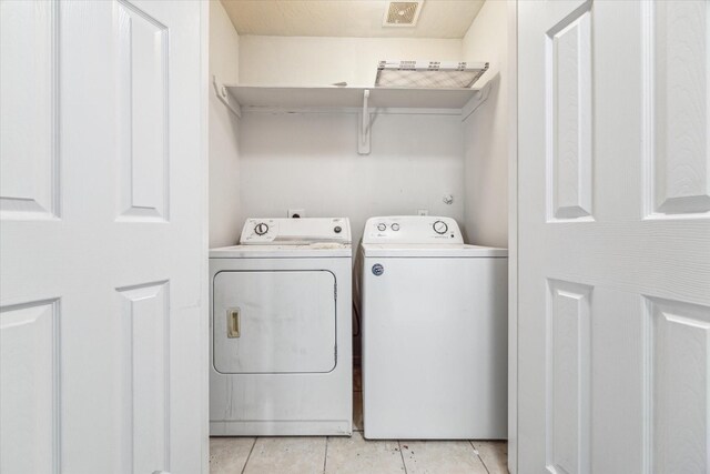 4340 Phlox St A/B, Unit A/B Houston, TX 77051 - laundry area with washing machine and clothes dryer and light tile patterned floors
