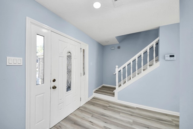 4211 Royal Manor Dr, Pasadena, TX 77505 - foyer entrance featuring stairs and wood finished floors