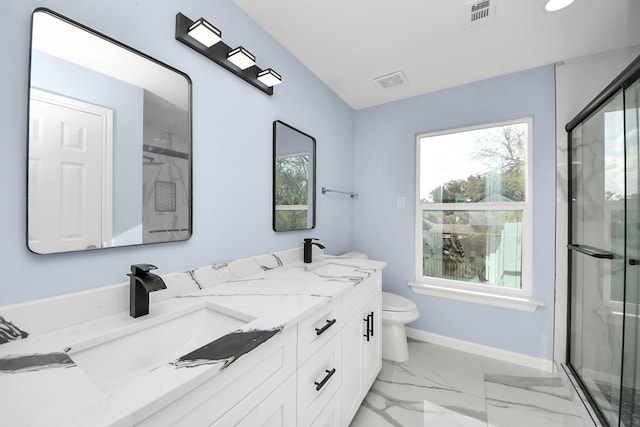 4211 Royal Manor Dr, Pasadena, TX 77505 - bathroom with marble finish flooring, double vanity, and a stall shower