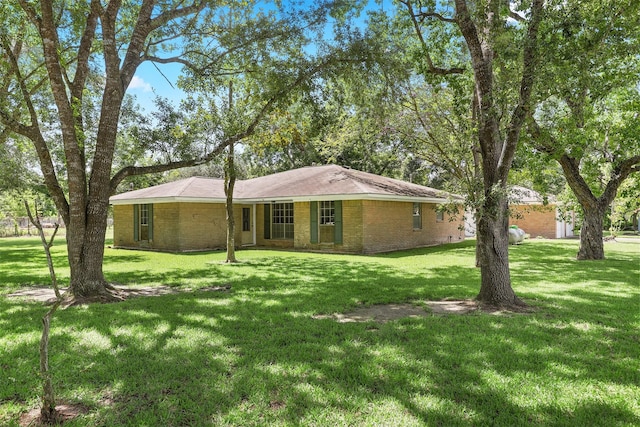 13329 24th St, Santa Fe, TX 77510 - view of front of house with brick siding and a front lawn