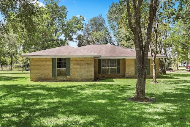 13329 24th St, Santa Fe, TX 77510 - view of front of home with a front yard and brick siding