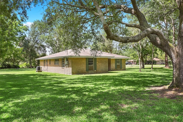 13329 24th St, Santa Fe, TX 77510 - back of property with a yard and brick siding