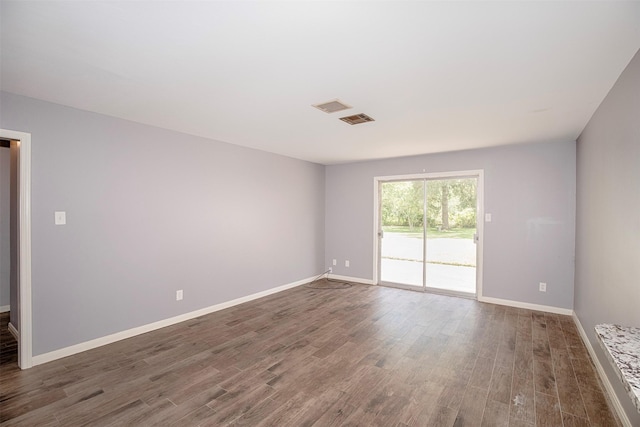13329 24th St, Santa Fe, TX 77510 - spare room with wood finished floors and baseboards