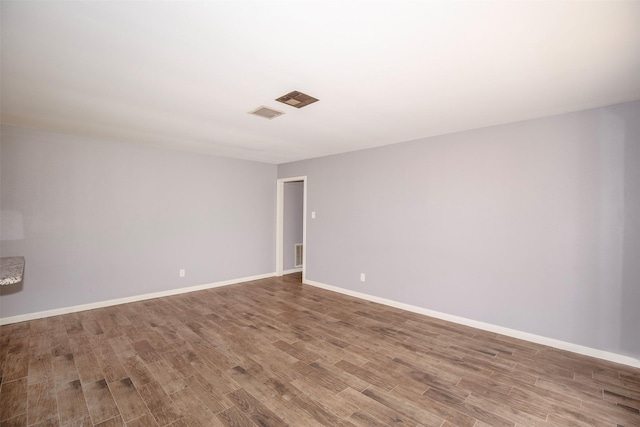 13329 24th St, Santa Fe, TX 77510 - empty room with wood finished floors and baseboards