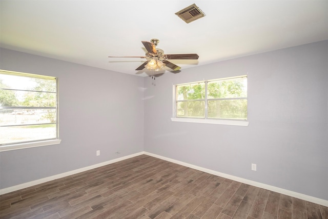 13329 24th St, Santa Fe, TX 77510 - unfurnished room with dark wood-style floors and ceiling fan