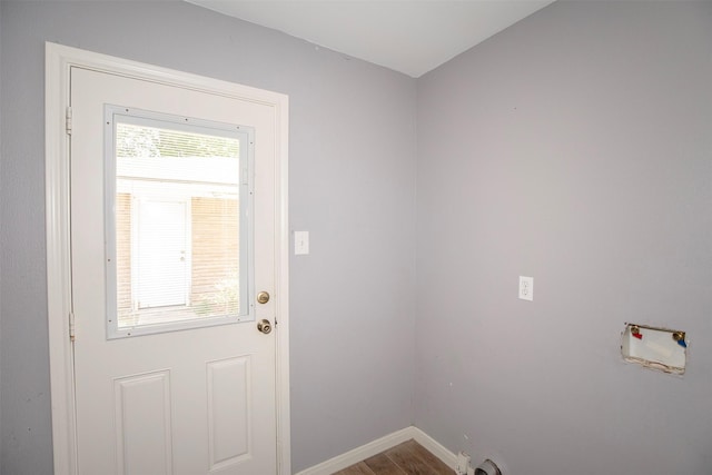13329 24th St, Santa Fe, TX 77510 - doorway featuring baseboards and wood finished floors