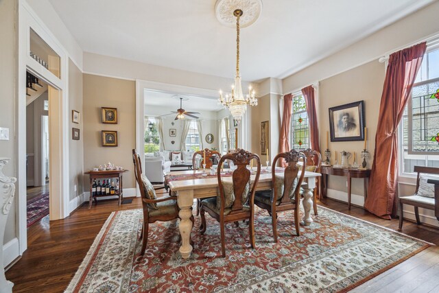 607 11th St, Galveston, TX 77550 - dining space featuring a chandelier, healthy amount of natural light, dark wood-style flooring, and ceiling fan