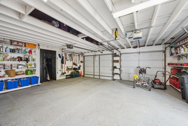 607 11th St, Galveston, TX 77550 - garage featuring a garage door opener