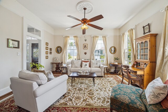 607 11th St, Galveston, TX 77550 - living room featuring a ceiling fan and wood finished floors
