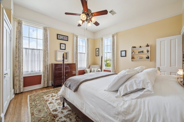 607 11th St, Galveston, TX 77550 - bedroom featuring wood finished floors and ceiling fan