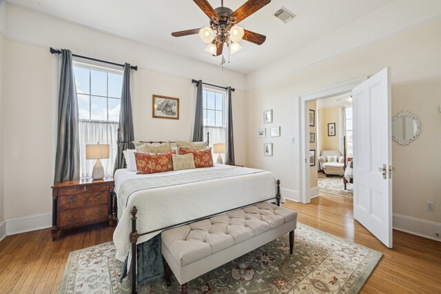 607 11th St, Galveston, TX 77550 - bedroom with light wood-style floors and a ceiling fan