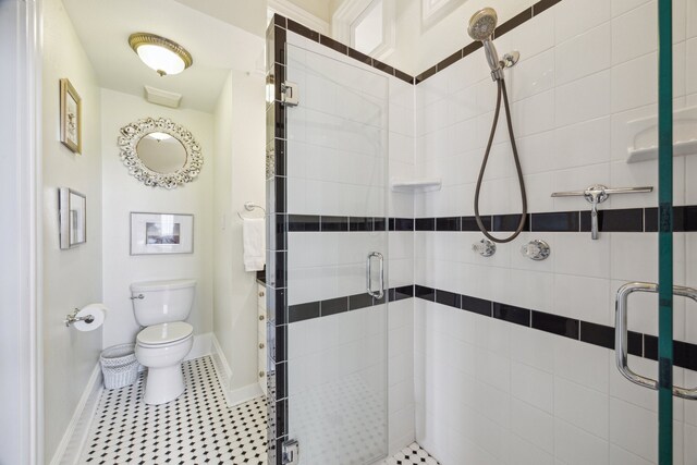 607 11th St, Galveston, TX 77550 - bathroom with a stall shower and tile patterned floors