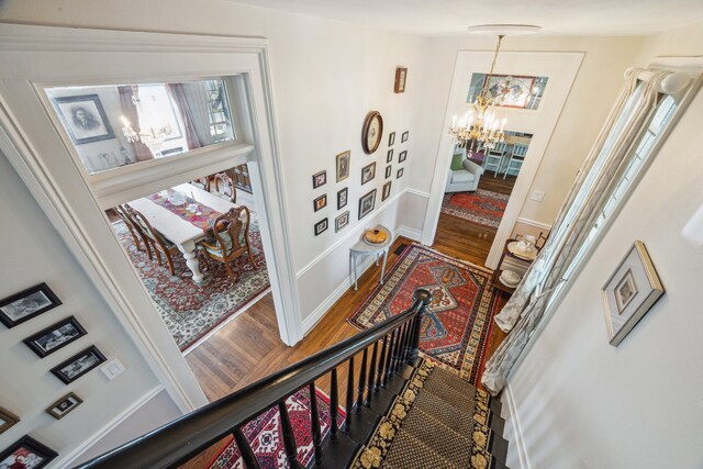 607 11th St, Galveston, TX 77550 - corridor with a chandelier and wood finished floors