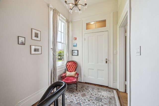 607 11th St, Galveston, TX 77550 - foyer featuring a chandelier and plenty of natural light