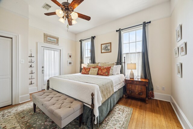 607 11th St, Galveston, TX 77550 - bedroom featuring light wood-type flooring and a ceiling fan