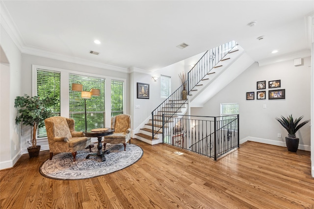 234 Knox St, Houston, TX 77007 - sitting room with wood finished floors, crown molding, an upstairs landing, and recessed lighting