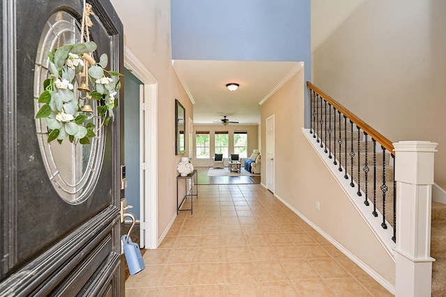 28503 Cece Glen Ct, Spring, TX 77386 - foyer entrance featuring stairway, ornamental molding, a ceiling fan, and light tile patterned floors