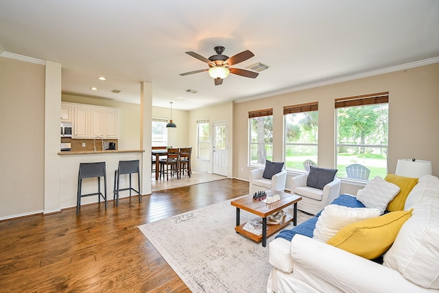 28503 Cece Glen Ct, Spring, TX 77386 - living room featuring a ceiling fan, wood finished floors, ornamental molding, and recessed lighting