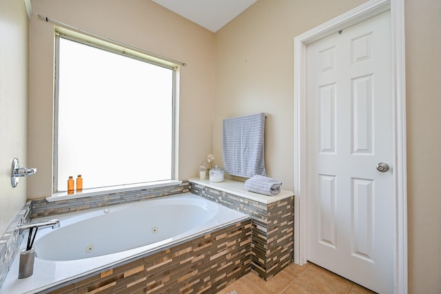 28503 Cece Glen Ct, Spring, TX 77386 - bathroom with a tub with jets and tile patterned flooring