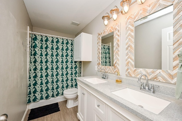 28503 Cece Glen Ct, Spring, TX 77386 - full bath featuring double vanity, wood finished floors, and a shower with curtain