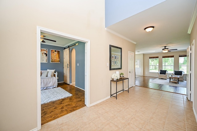 28503 Cece Glen Ct, Spring, TX 77386 - hallway featuring arched walkways, crown molding, and light wood-style flooring