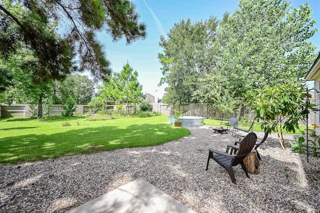 28503 Cece Glen Ct, Spring, TX 77386 - fenced backyard featuring a fire pit and a patio