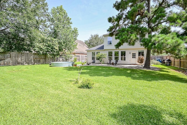 28503 Cece Glen Ct, Spring, TX 77386 - back of property featuring a fenced backyard, a patio area, and a hot tub