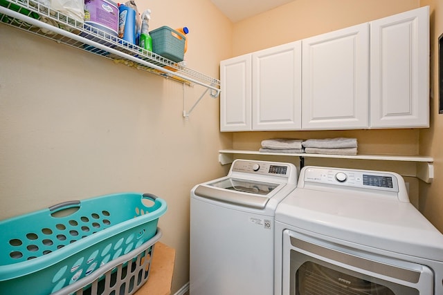 28503 Cece Glen Ct, Spring, TX 77386 - laundry room featuring washer and dryer and cabinet space