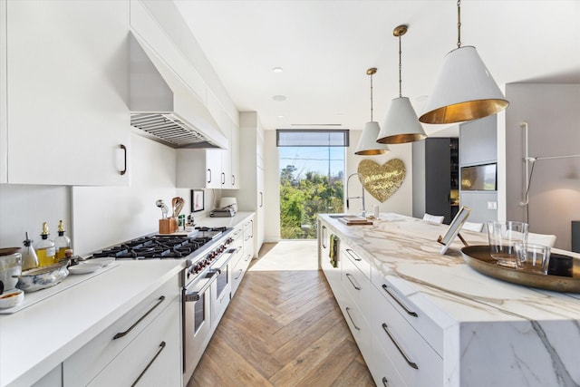 2019 Du Barry Ln, Houston, TX 77018 - kitchen with double oven range, custom range hood, white cabinetry, pendant lighting, and light stone counters