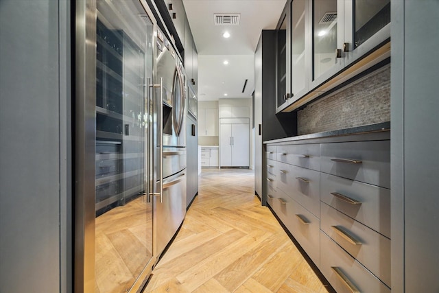 2019 Du Barry Ln, Houston, TX 77018 - kitchen featuring beverage cooler, glass insert cabinets, backsplash, gray cabinets, and recessed lighting