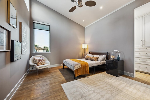 2019 Du Barry Ln, Houston, TX 77018 - bedroom with wood finished floors, high vaulted ceiling, and crown molding