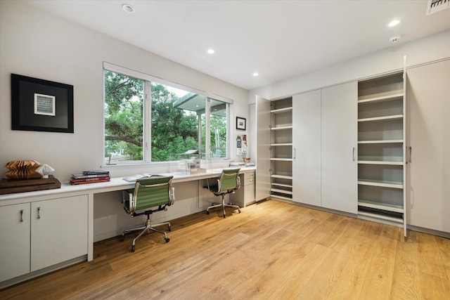 2019 Du Barry Ln, Houston, TX 77018 - office featuring built in desk, light wood-style floors, and recessed lighting