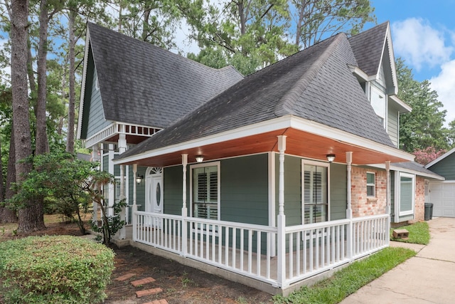 2822 Roseheath Ln, Houston, TX 77073 - view of home's exterior featuring a porch, roof with shingles, a garage, and driveway
