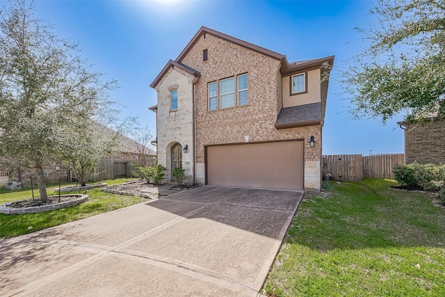 4310 Tilbury Trl, Richmond, TX 77407 - view of front of house featuring a garage, driveway, stone siding, and brick siding