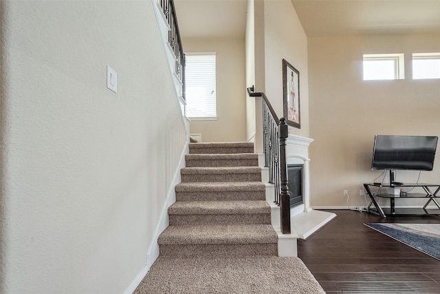 4310 Tilbury Trl, Richmond, TX 77407 - stairway with wood finished floors and baseboards