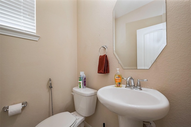 4310 Tilbury Trl, Richmond, TX 77407 - half bathroom featuring a sink and toilet