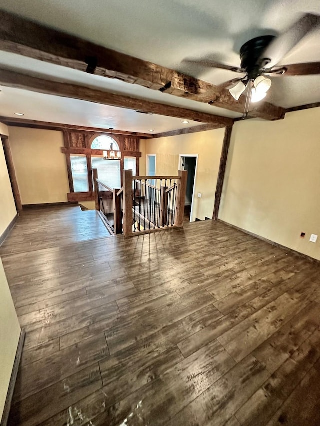 4842 Green Trail Dr, Houston, TX 77084 - unfurnished living room featuring beam ceiling, wood finished floors, and ceiling fan