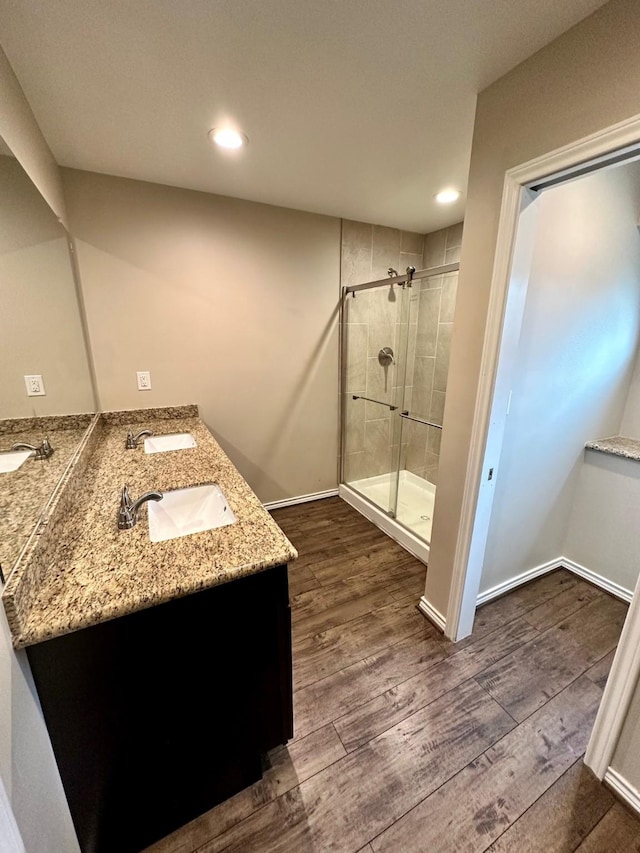 4842 Green Trail Dr, Houston, TX 77084 - full bath featuring a shower stall, wood finished floors, double vanity, and recessed lighting