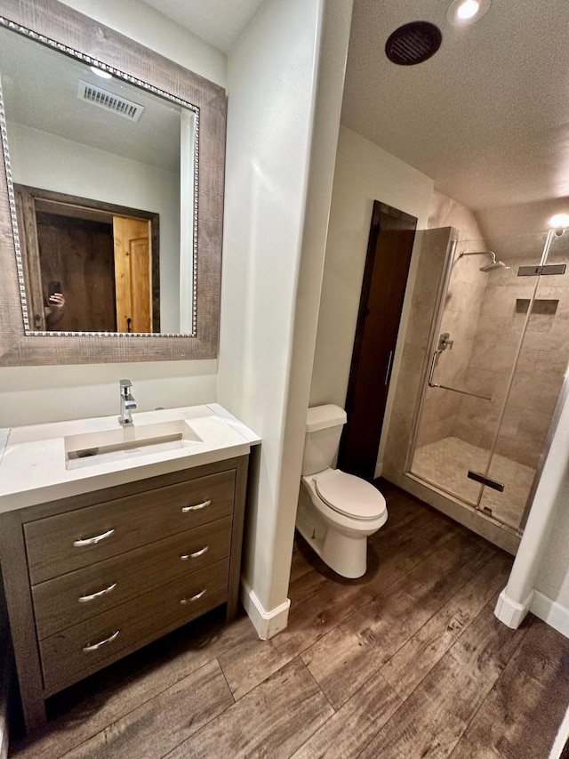 4842 Green Trail Dr, Houston, TX 77084 - full bath featuring wood finished floors, vanity, and a stall shower