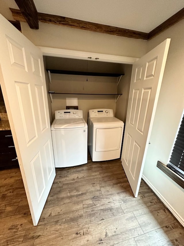 4842 Green Trail Dr, Houston, TX 77084 - laundry area with crown molding, separate washer and dryer, and wood finished floors