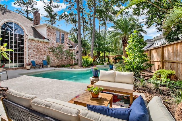 13718 Gainesway Dr, Cypress, TX 77429 - view of swimming pool with outdoor lounge area, a patio, and a fenced backyard