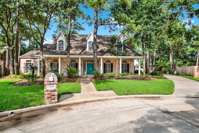 13718 Gainesway Dr, Cypress, TX 77429 - new england style home with brick siding and covered porch