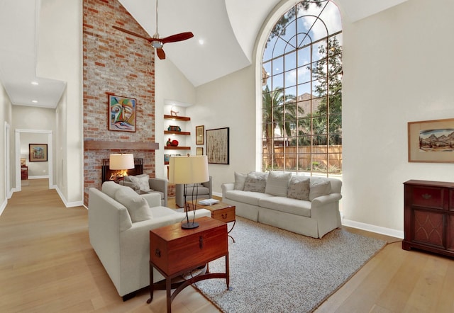 13718 Gainesway Dr, Cypress, TX 77429 - living room featuring high vaulted ceiling, a fireplace, wood finished floors, ceiling fan, and built in features