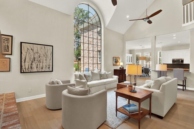 13718 Gainesway Dr, Cypress, TX 77429 - living room with high vaulted ceiling, light wood finished floors, and a ceiling fan