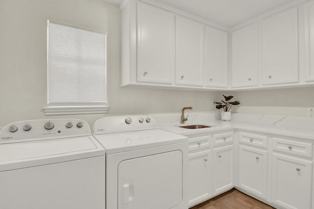 13718 Gainesway Dr, Cypress, TX 77429 - laundry area featuring washer and clothes dryer and cabinet space